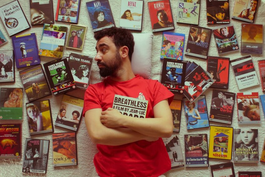 Man surrounded by physical movies.